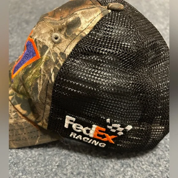 NASCAR Joe Gibbs Racing Camo hat with purple 11 embroidered with orange trim. - Picture 2 of 3